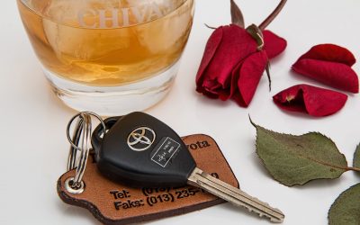 A glass of liquor by a set of car keys. A lawyer can explain if you can be charged with vehicular manslaughter for a DUI in California.