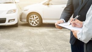 An insurance adjuster discusses with a policyholder about what to do if they hit someone who doesn’t have insurance.