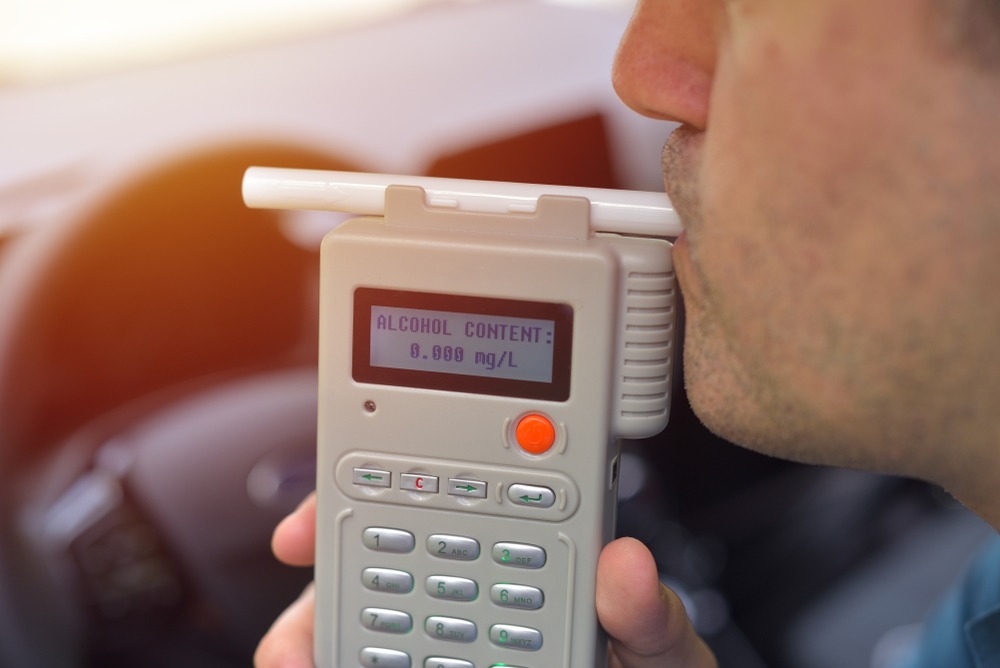 driver takes breathalyzer test