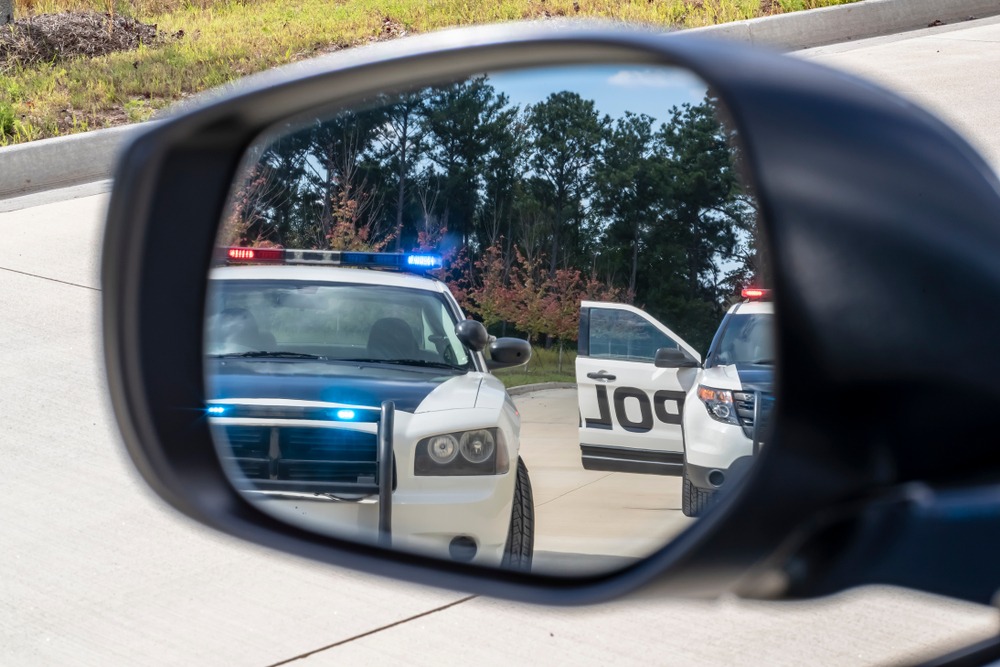 police cars visible in side view mirror