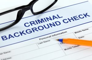 A criminal background check form about to get filled out.