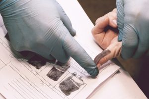 Taking fingerprints at a booking.