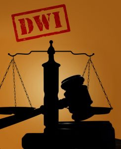An image of scales in shadow with a DWI stamp.