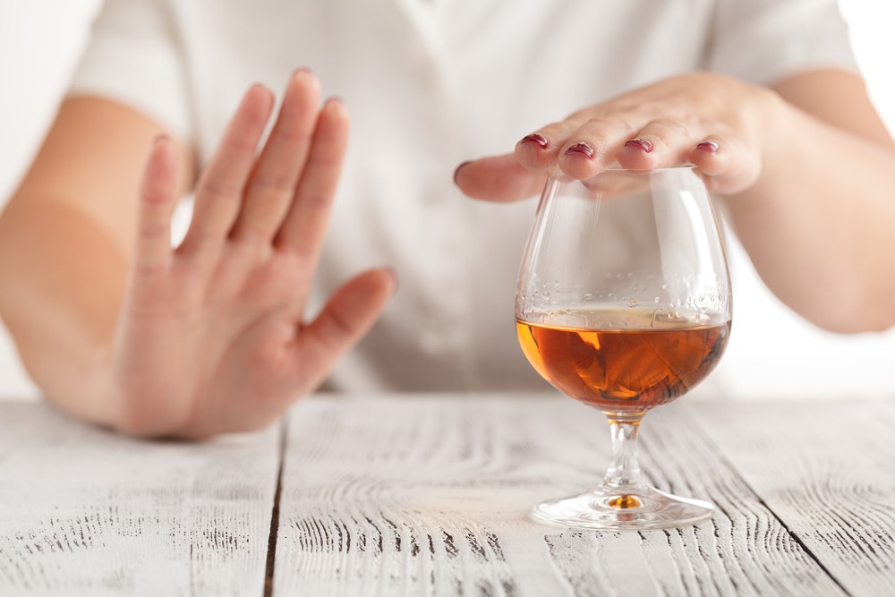 woman refusing more alcohol