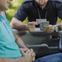 cop inspecting a CA license