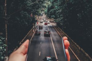 A road coming out of a phone. Find out how you can get your DUI charges reduced in California with a lawyer.
