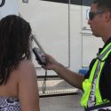 Police administering a BAC test to an impaired driver.