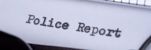 typewriter showing police report