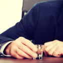 businessman with shot glass