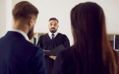 man at a court hearing with his lawyer