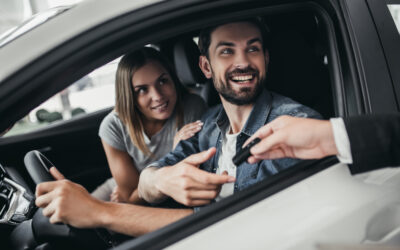 A man and woman renting a vehicle. A lawyer can explain if you can rent a car with a DUI.