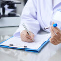 medical worker writing results of a blood test