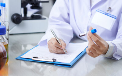 medical worker writing results of a blood test