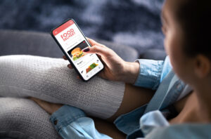 A driver looks over the Grubhub app and wonders if he can drive for them with a DUI on his record.