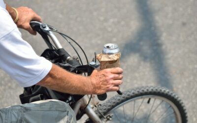 A man riding a bike with a beer. Determine if you can get a DUI on a bike in California.