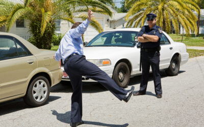 An officer administering a field sobriety test on a suspected drunk driver who did not refuse.
