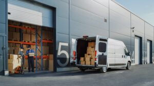 A delivery man handling boxes at a warehouse asks a coworker, “Can you drive for UPS with a DUI?”