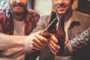 A couple of friends are drinking beer before wondering, “Can you get a DUI for an open container?”