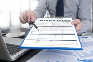 A man holding a job application. A lawyer can explain if you should disclose your DUI on a job application.
