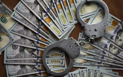 Handcuffs on a stack of cash. How much is bond for a DUI in LA?
