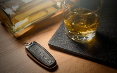 Car keys by a glass of alcohol. A lawyer can explain if you lose your California driver’s license after a DUI conviction.