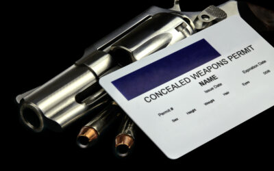 A revolver and bullets appear with a concealed weapon permit. Whether you can get a concealed carry permit with a DUI depends on several factors, including the nature of the DUI offense and how much time has passed since the conviction.