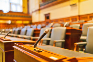 An empty courtroom. A lawyer can help you learn what percentage of DUI cases get dismissed in California.