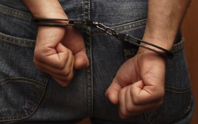 Person in handcuffs wondering if a 3rd DUI is a felony in California.