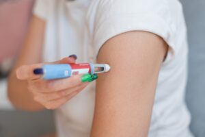 A woman injects Ozempic and wonders, “Can you get a DUI for driving on Ozempic?”