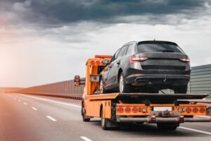 A car getting towed. Learn about Santa Ana DUI impound lots.