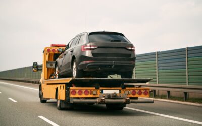 A tow truck transports a vehicle to an Orange County DUI impound lot.