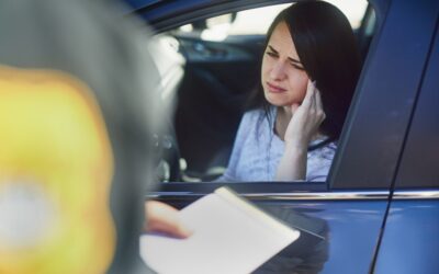 A woman getting pulled over for her third DUI, wondering if she can get a restricted license.