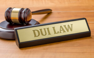 Placard labeled “DUI Law” next to a gavel to symbolize the question of, “What are common plea bargain options for felony DUI charges?”