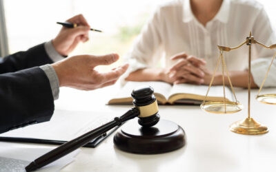Lawyer sits at desk with client and explains what they should know about a third offense DUI case.