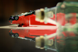 Overturned toy truck with empty bottle in foreground. Things to know about a commercial DUI case