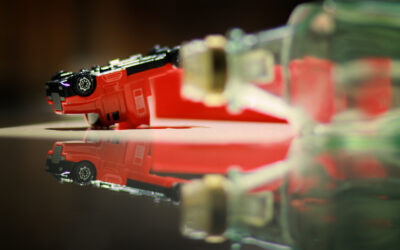 Overturned toy truck with empty bottle in foreground. Things to know about a commercial DUI case