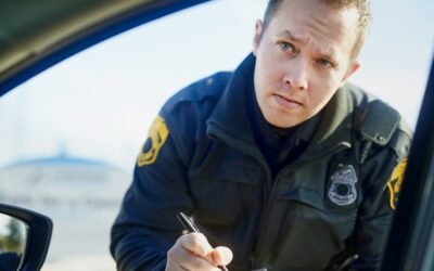 Police officer issuing a ticket at a DUI checkpoint. 12 mistakes to avoid after a DUI checkpoint arrest