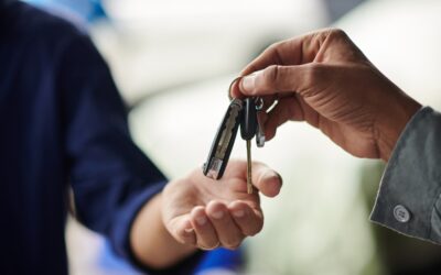 Close-up of someone handing car keys over to another person after their DUI probation is over in CA.