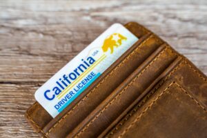 California driver’s license inside a wallet that is valid after the owner received a DMV set-aside after a license suspension.